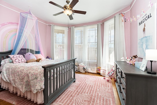 bedroom featuring a ceiling fan and light wood-style flooring