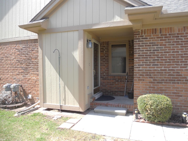 entrance to property with brick siding