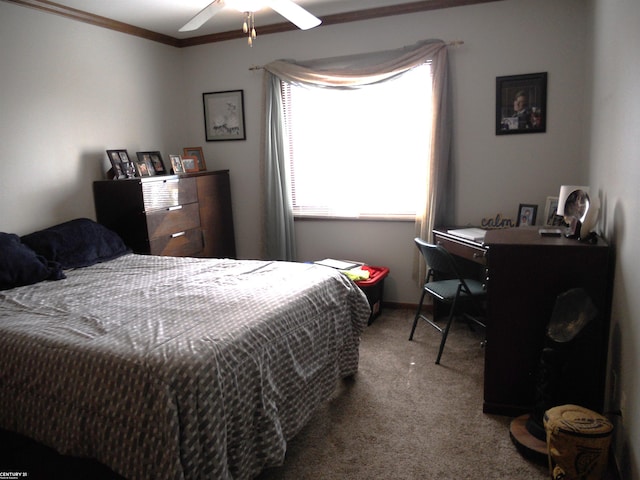 carpeted bedroom with ornamental molding and a ceiling fan