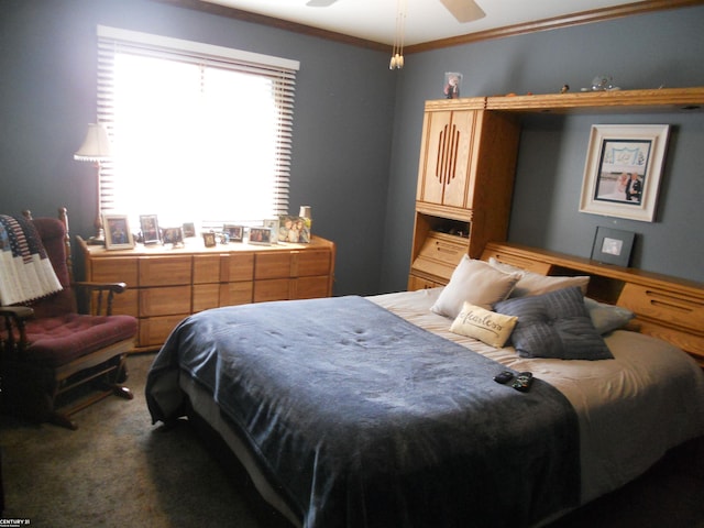 bedroom with dark carpet, a ceiling fan, and ornamental molding