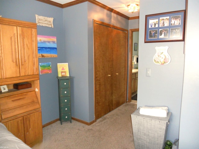 bedroom with crown molding, light colored carpet, and baseboards