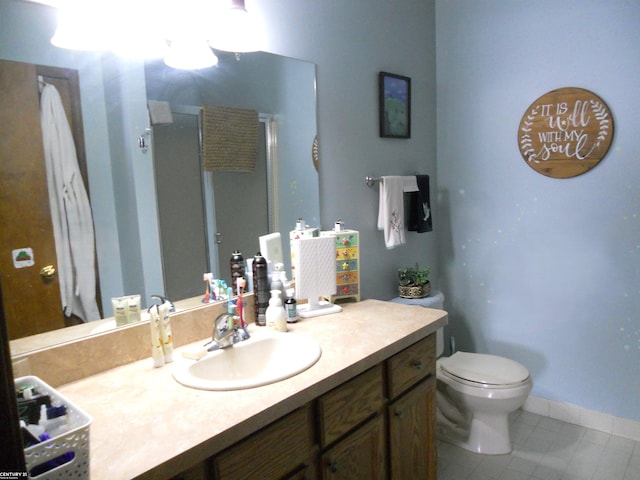 full bath with toilet, a stall shower, tile patterned floors, and vanity