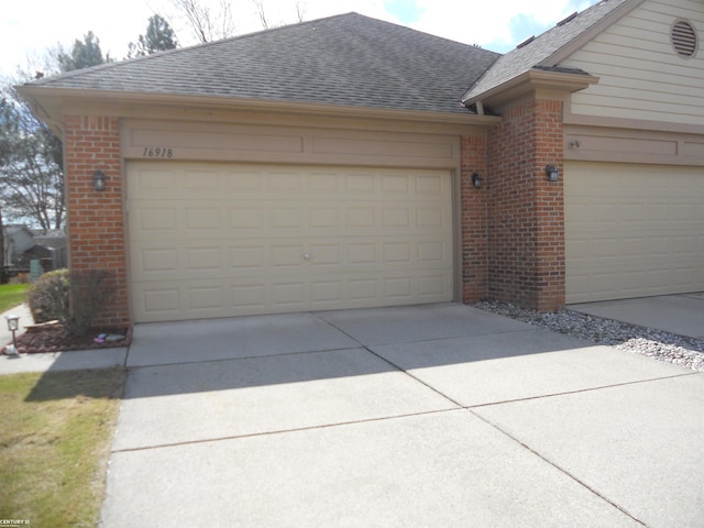 garage with concrete driveway