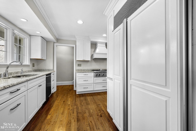 kitchen with white cabinetry, a sink, dishwashing machine, ornamental molding, and custom exhaust hood