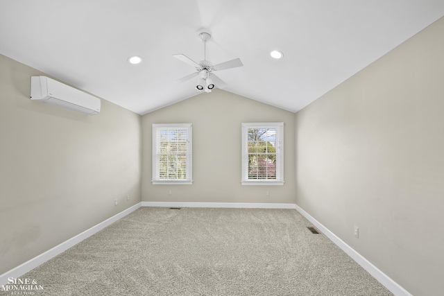 spare room featuring light carpet, a ceiling fan, lofted ceiling, and a wall mounted AC