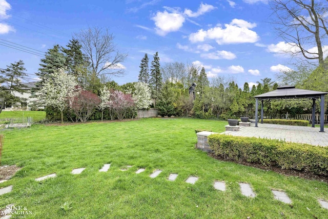view of yard with a patio, a gazebo, and fence