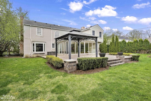 back of house featuring a yard, a gazebo, and a patio area