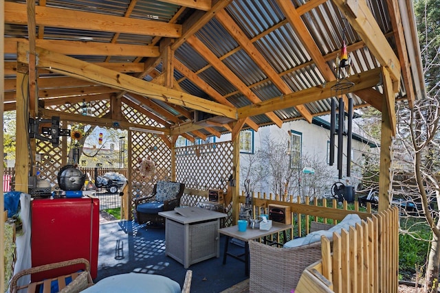 view of patio with fence and a gazebo
