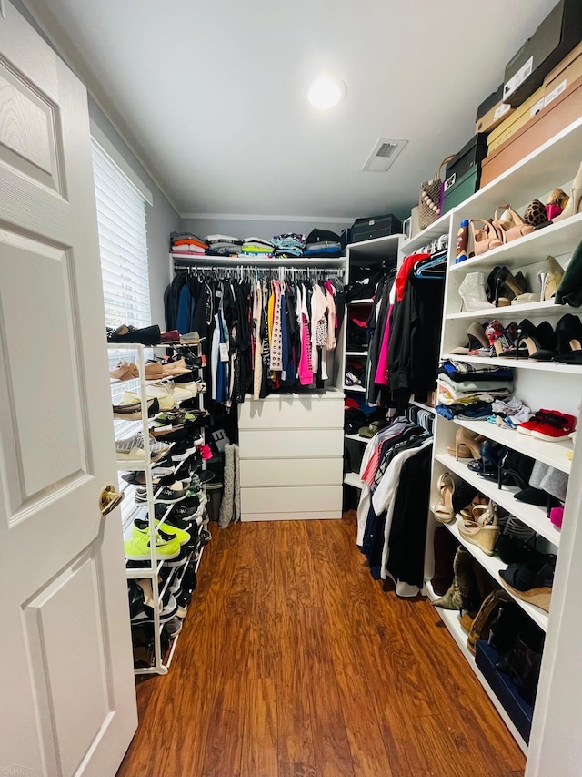 spacious closet with visible vents and wood finished floors