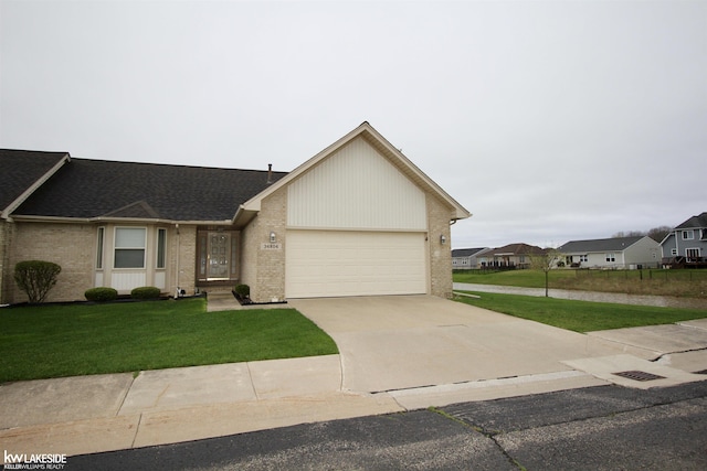 ranch-style home with a garage, brick siding, a front lawn, concrete driveway, and a shingled roof