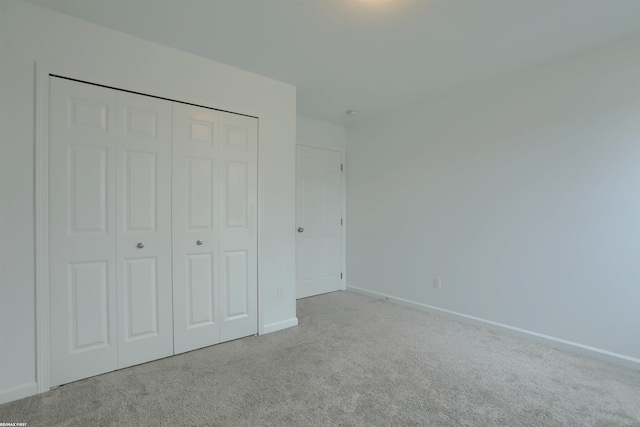 unfurnished bedroom with baseboards and carpet floors