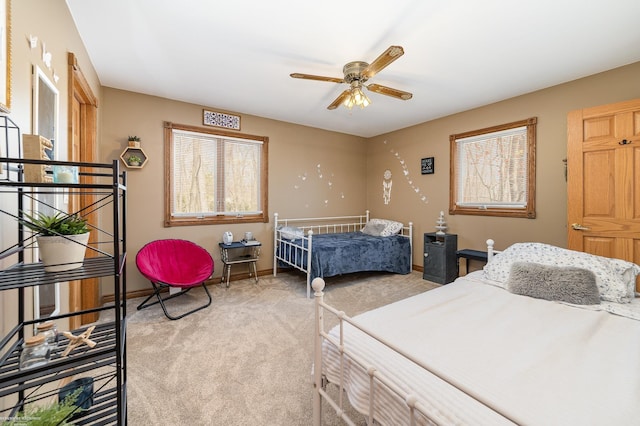 carpeted bedroom with baseboards