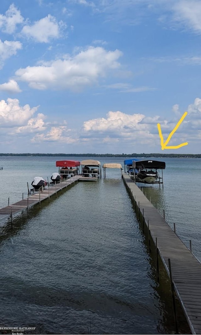view of dock with a water view and boat lift