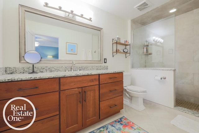 full bathroom with visible vents, walk in shower, toilet, tile patterned floors, and vanity