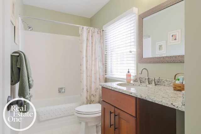 bathroom with toilet, shower / tub combo, and vanity