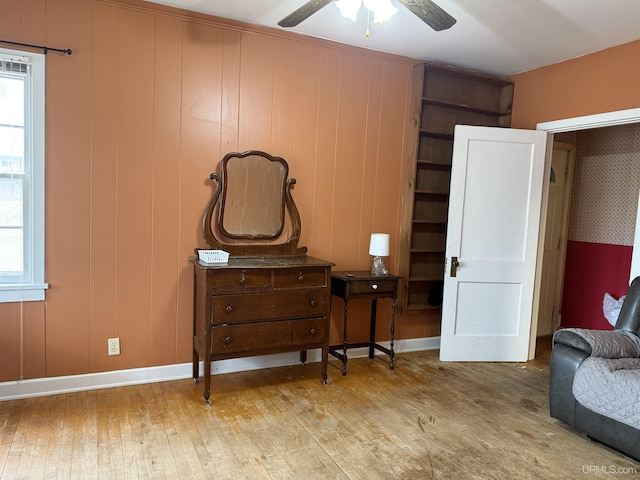 sitting room featuring ceiling fan, hardwood / wood-style floors, and baseboards