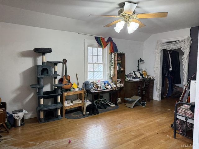 miscellaneous room with lofted ceiling, ceiling fan, and hardwood / wood-style flooring