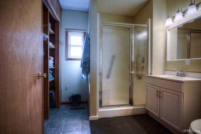 bathroom featuring vanity and a shower stall