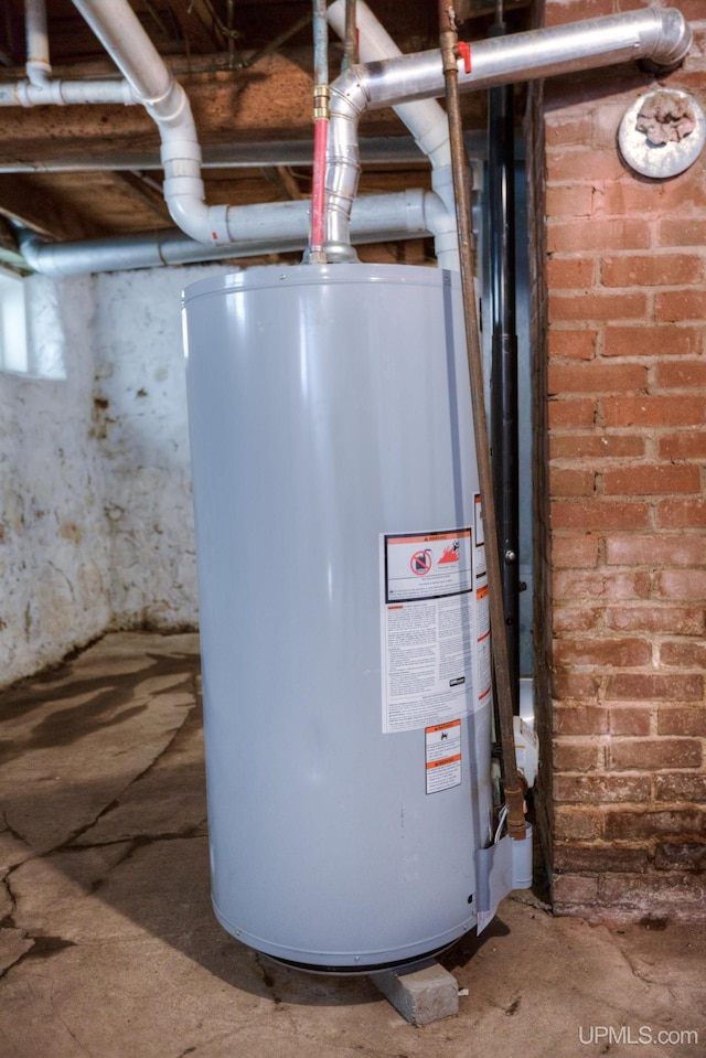 utility room with gas water heater