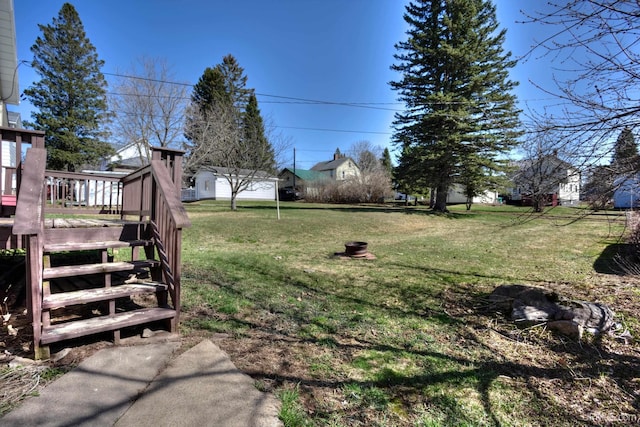 view of yard with a wooden deck