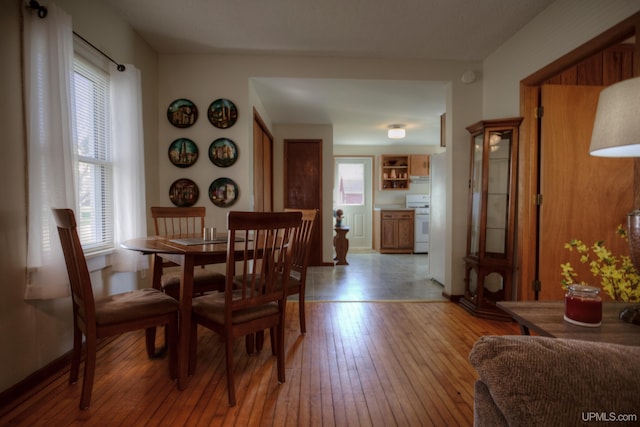 dining area featuring light wood-style flooring