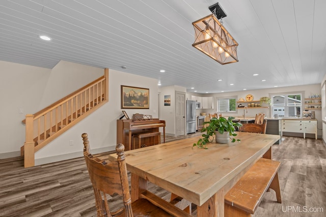 dining area featuring wooden ceiling, recessed lighting, light wood-style flooring, and stairs