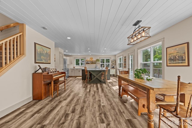 dining space with wood finished floors, recessed lighting, stairs, and wooden ceiling