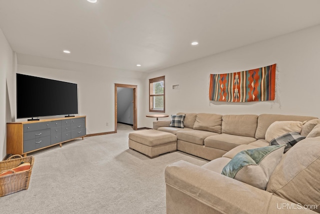 living area featuring baseboards, recessed lighting, and light carpet