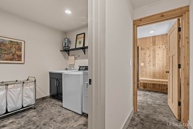 laundry room with recessed lighting, a sink, cabinet space, washing machine and clothes dryer, and baseboards