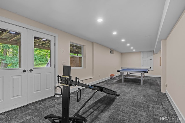 workout room featuring recessed lighting, dark carpet, and baseboards