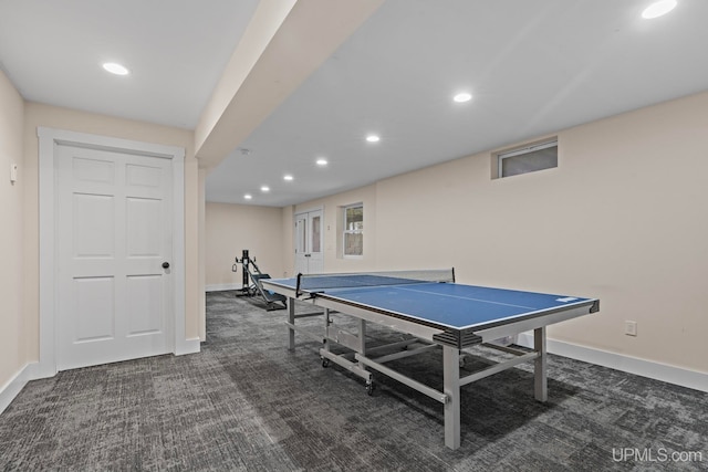 recreation room with dark colored carpet, recessed lighting, and baseboards