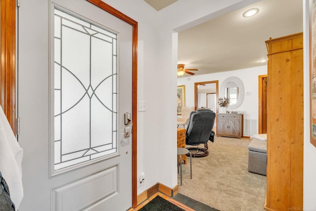 carpeted foyer featuring visible vents, a ceiling fan, recessed lighting, and baseboards