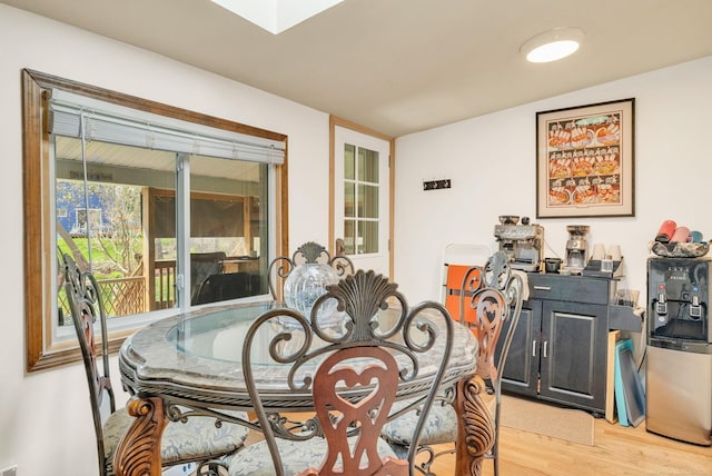 dining space with light wood-style floors