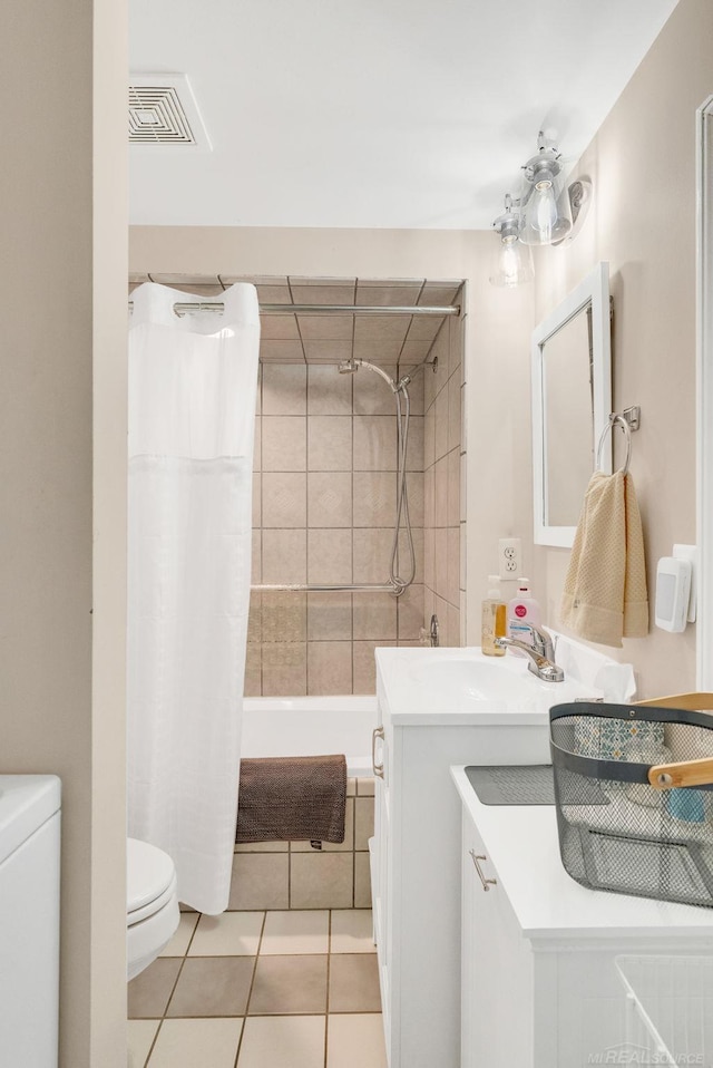 bathroom featuring tile patterned floors, shower / bath combination with curtain, toilet, vanity, and visible vents