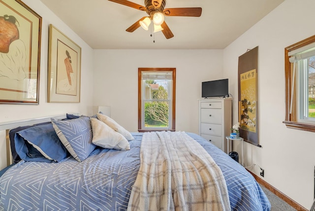 bedroom with baseboards and ceiling fan