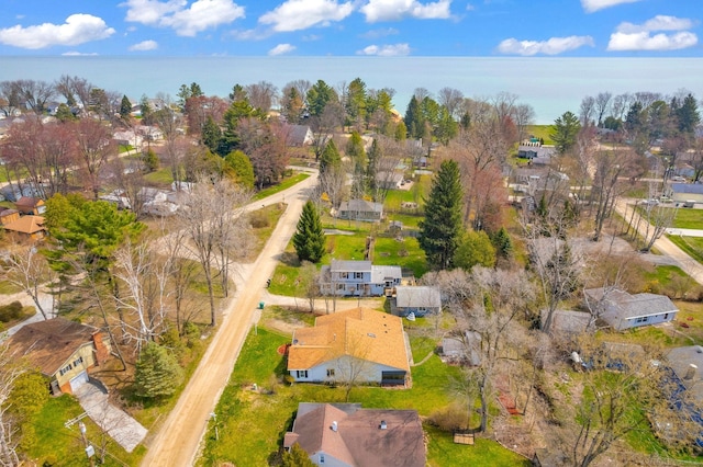 birds eye view of property with a residential view and a water view