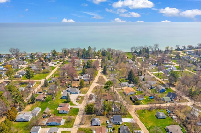 bird's eye view featuring a residential view and a water view