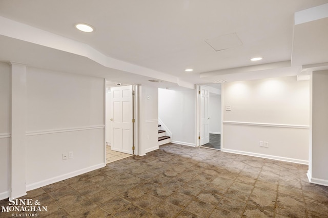 finished below grade area featuring recessed lighting, stairway, and baseboards