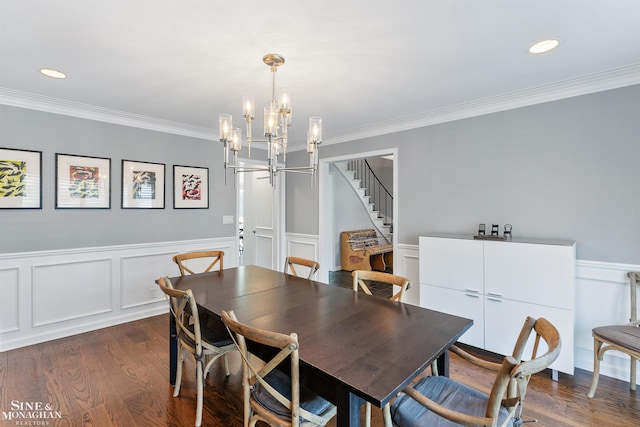 dining area featuring crown molding, stairway, dark wood-style flooring, and a chandelier