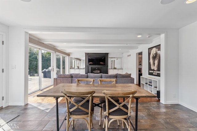 dining room with baseboards, recessed lighting, stone finish flooring, and beam ceiling