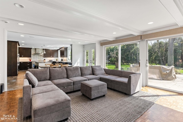 sunroom featuring plenty of natural light, french doors, and beam ceiling