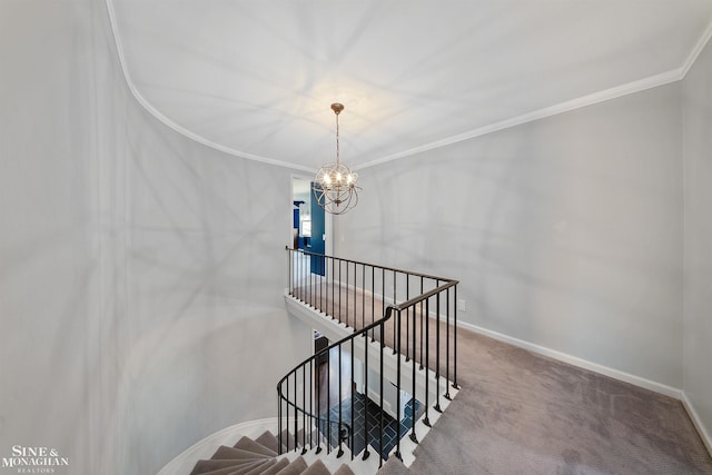 staircase with crown molding, baseboards, carpet flooring, and a notable chandelier