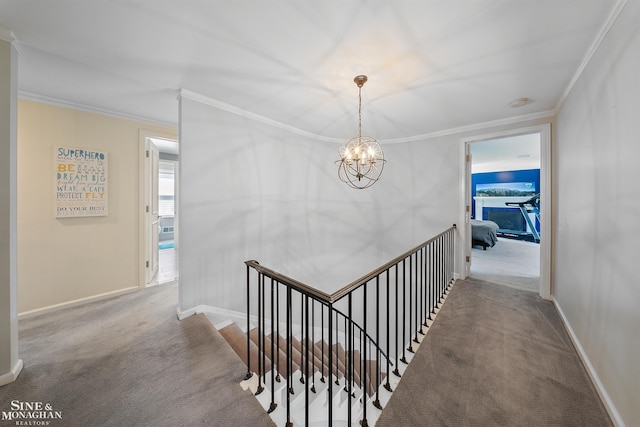 stairs featuring crown molding, baseboards, an inviting chandelier, and carpet