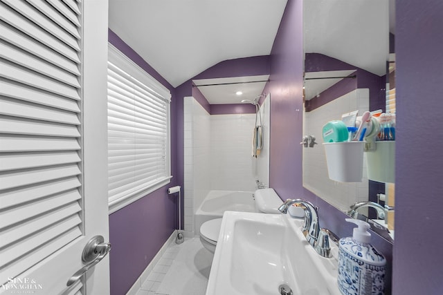 bathroom with tile patterned flooring, vaulted ceiling, a sink, baseboards, and toilet