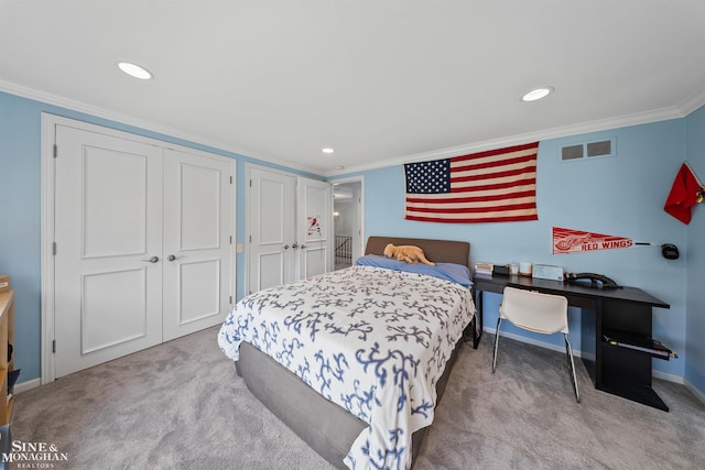 bedroom with visible vents, multiple closets, ornamental molding, carpet flooring, and recessed lighting