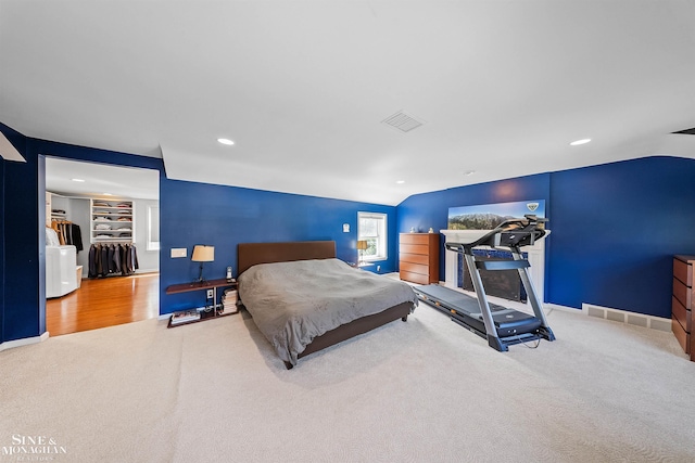 carpeted bedroom featuring baseboards, visible vents, recessed lighting, and lofted ceiling