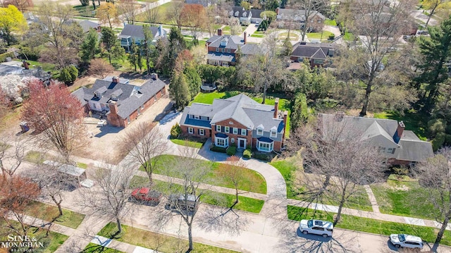 birds eye view of property with a residential view