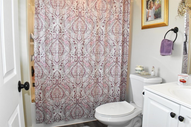 bathroom with vanity, toilet, and a shower with shower curtain