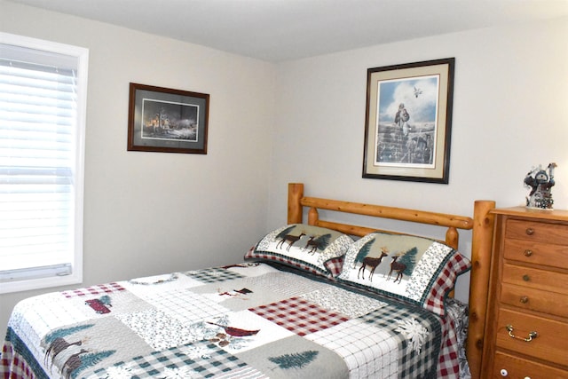 bedroom with multiple windows