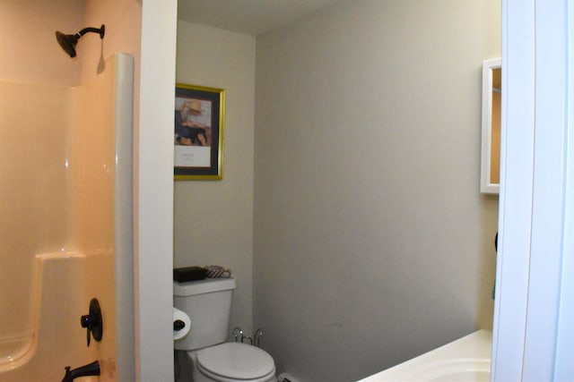 bathroom featuring walk in shower and toilet